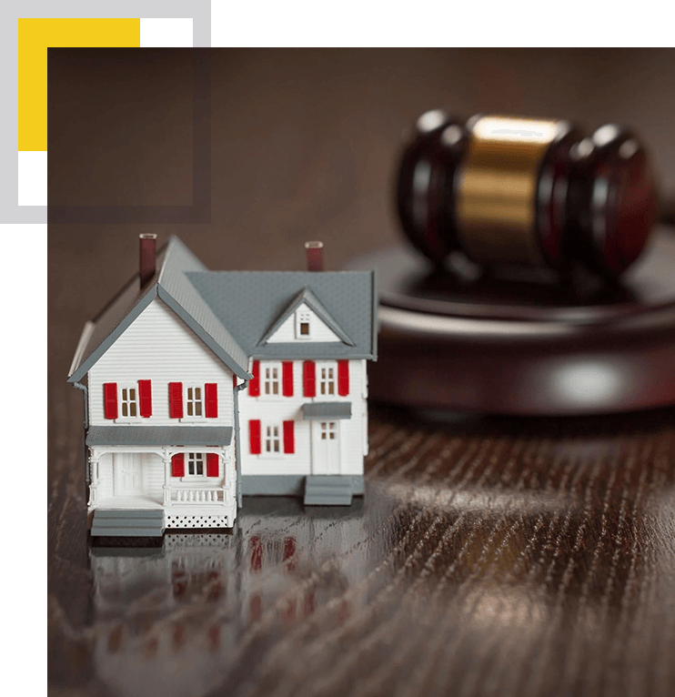 A close up of a toy house and gavel