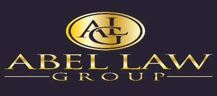 A gold and black logo for the angel law group.